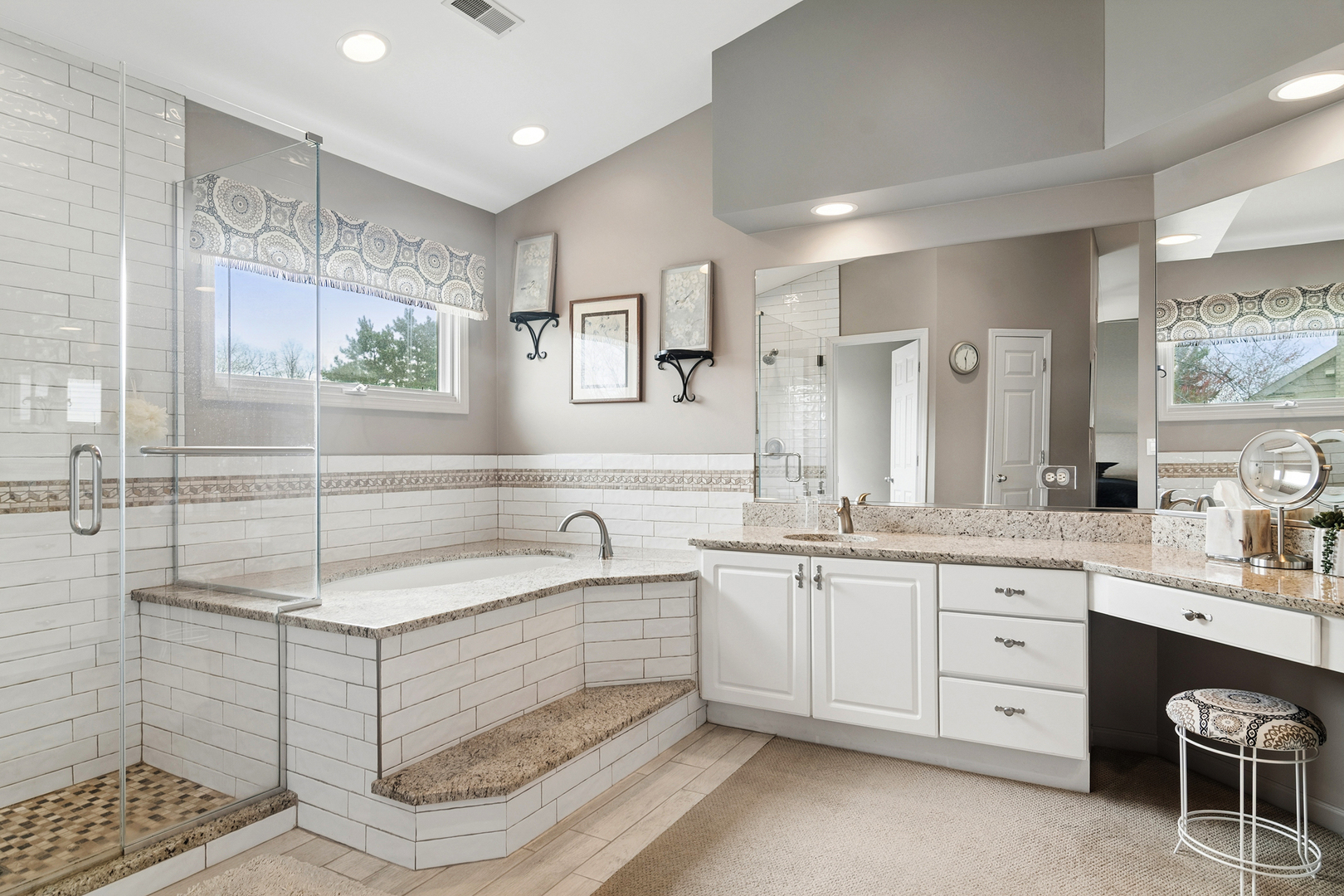 2038 Sheridan Road Buffalo Grove, IL 60089 - Photo 19 of 44 a spacious bathroom with a double vanity sink a mirror and a bathtub