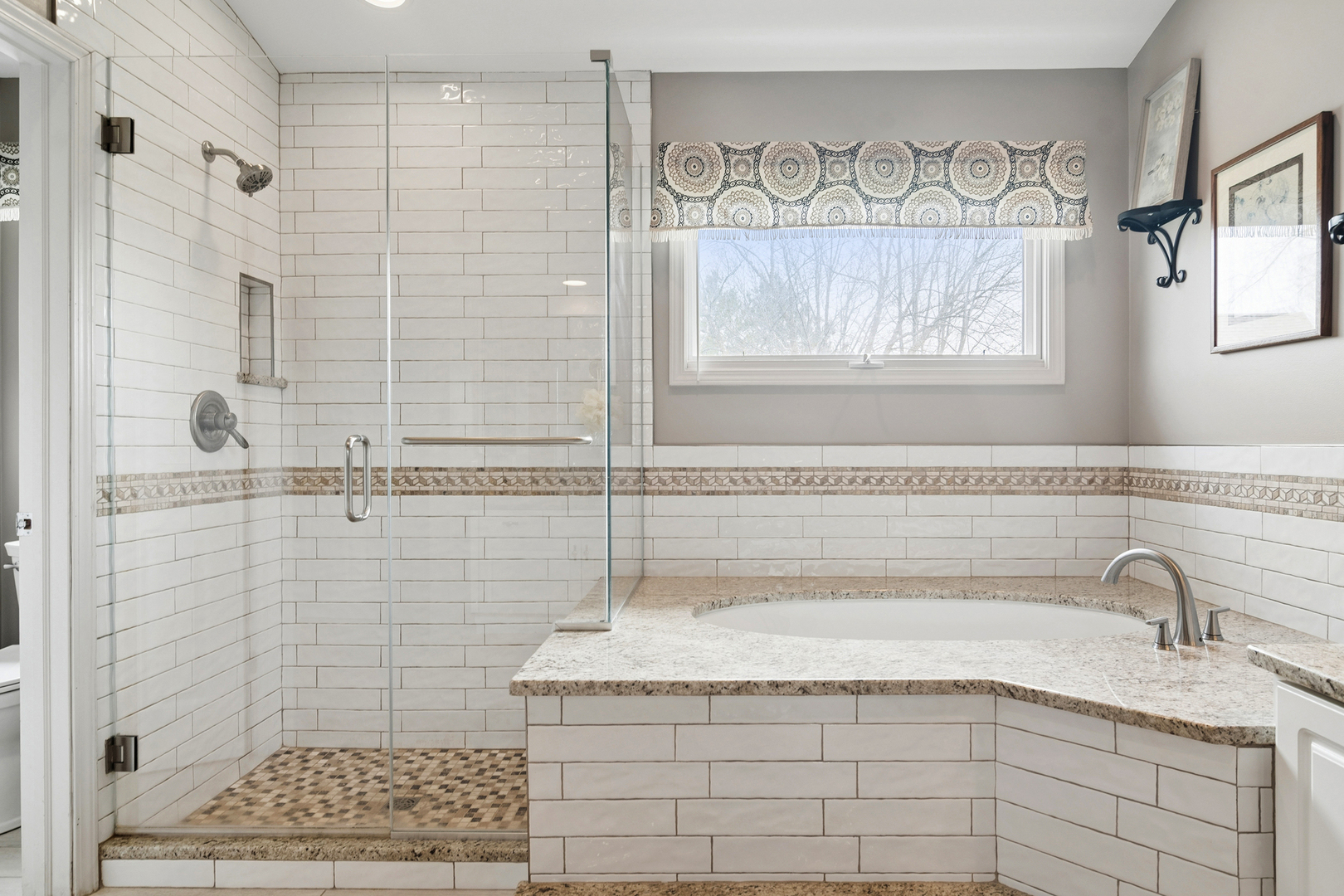 2038 Sheridan Road Buffalo Grove, IL 60089 - Photo 21 of 44 a bathroom with a granite countertop sink a mirror and shower