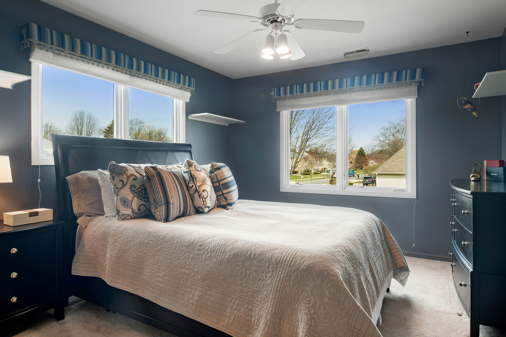 2038 Sheridan Road Buffalo Grove, IL 60089 - Photo 23 of 44 a large bed sitting in a bedroom next to a window