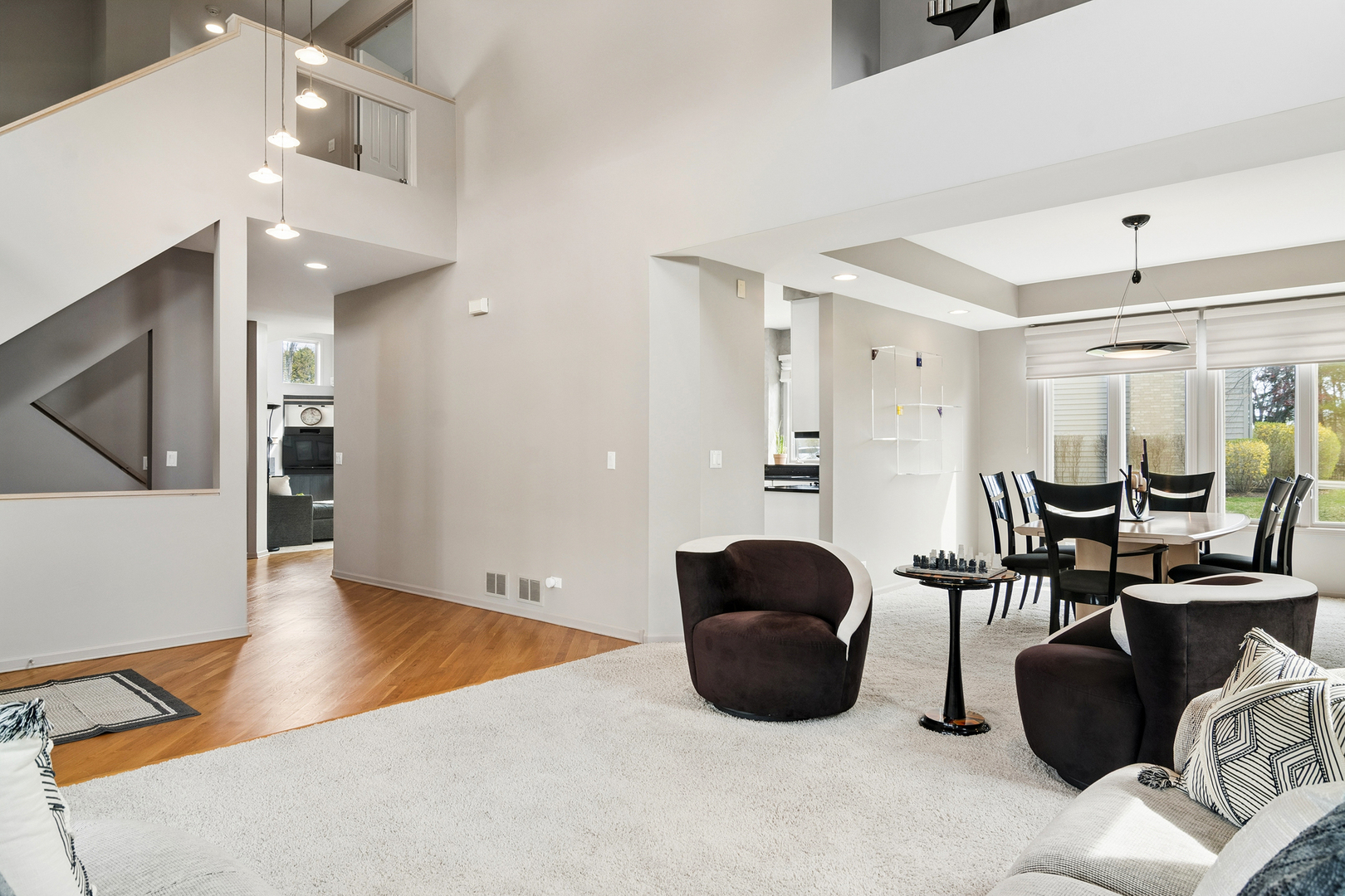 2038 Sheridan Road Buffalo Grove, IL 60089 - Photo 3 of 44 a living room with furniture a window and gym equipment