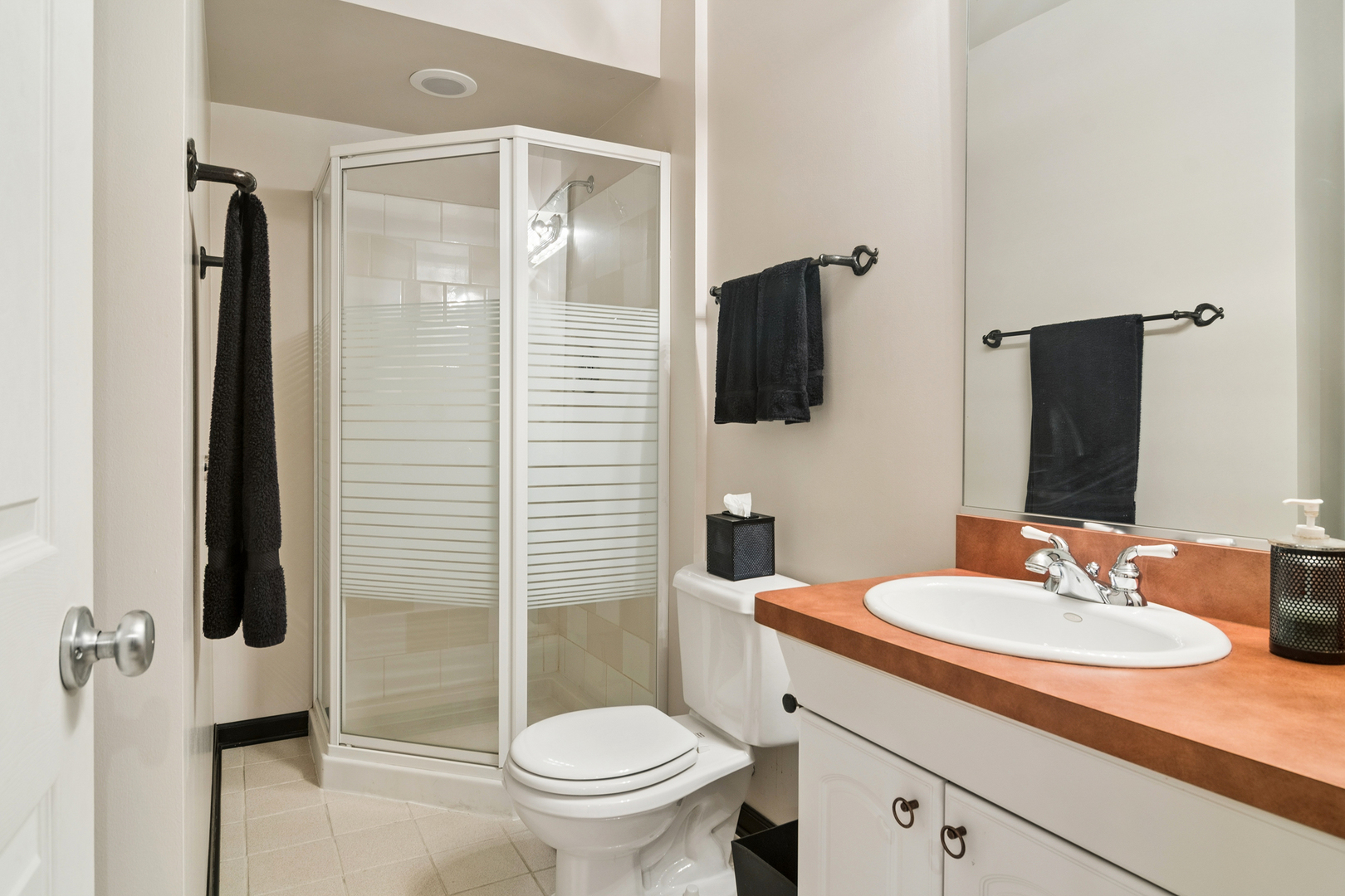 2038 Sheridan Road Buffalo Grove, IL 60089 - Photo 31 of 44 a bathroom with a sink toilet and shower