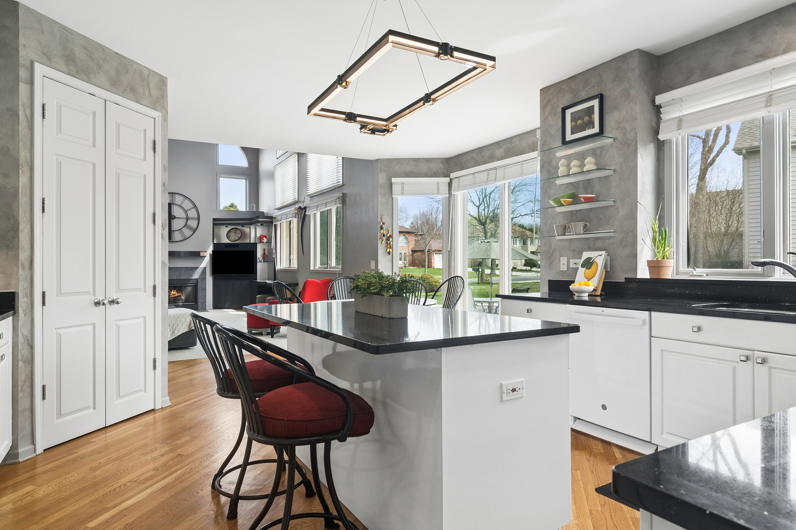 2038 Sheridan Road Buffalo Grove, IL 60089 - Photo 7 of 44 a kitchen with stainless steel appliances kitchen island granite countertop a table and chairs in it