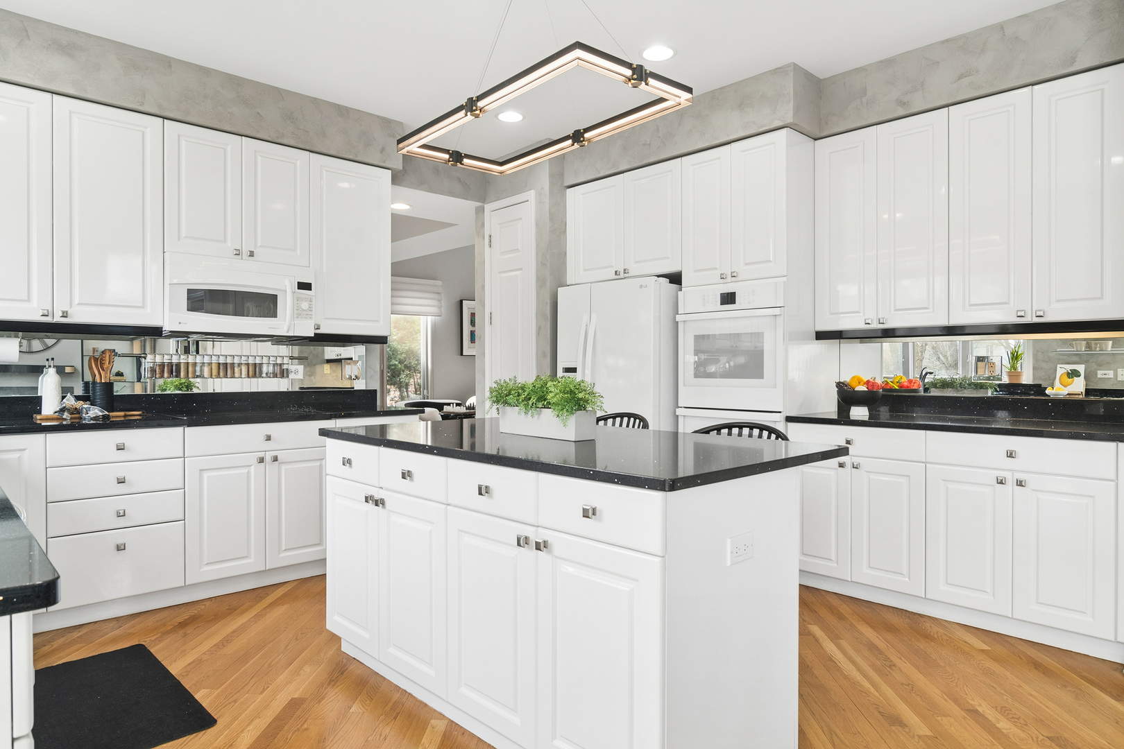 2038 Sheridan Road Buffalo Grove, IL 60089 - Photo 8 of 44 a kitchen with stainless steel appliances white cabinets and a refrigerator
