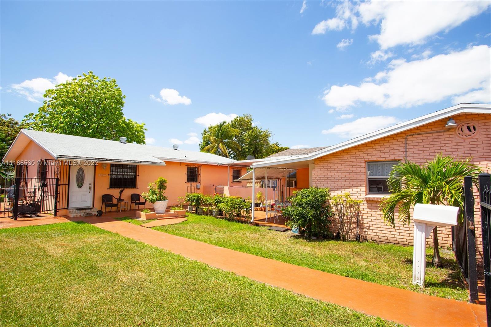 a front view of a house with a yard and porch