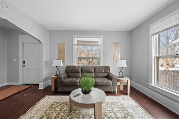 a living room with furniture and a window