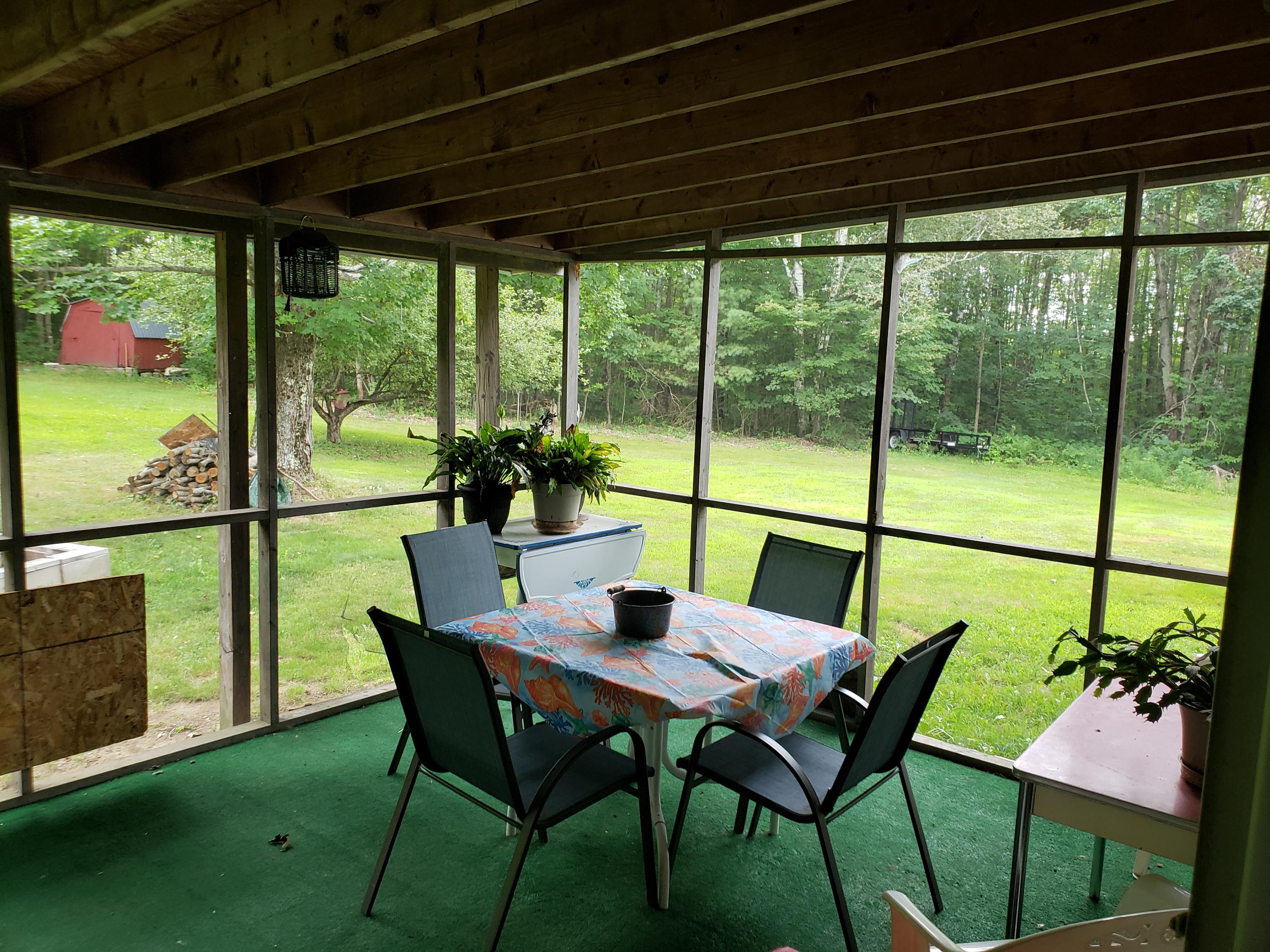 292 Staples Hill Road Canton, ME 04221 - Photo 23 of 28 Relax in the sunroom.