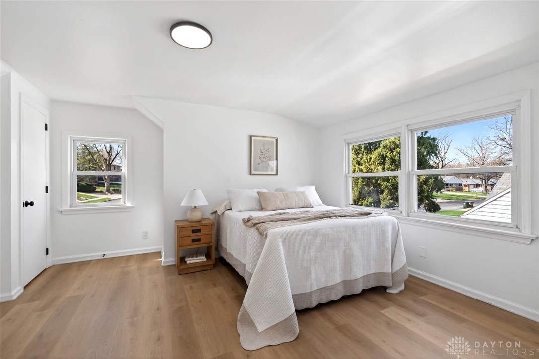 1243 Ridgeview Avenue Dayton, OH 45409 - Photo 32 of 56 This bright and airy bedroom features beautiful hardwood flooring and expansive windows offering serene views.