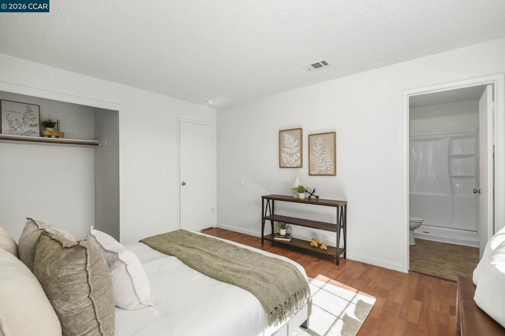 476 Pamela Drive Bay Point, CA 94565 - Photo 15 of 24 a bedroom with a bed and wooden floor