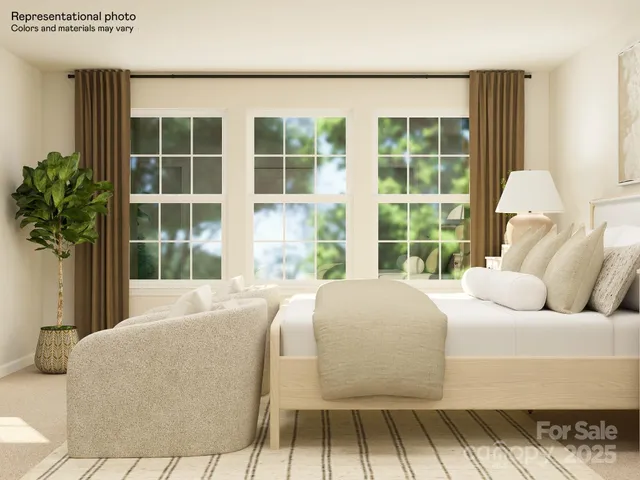 a bedroom with a bed and a lamp