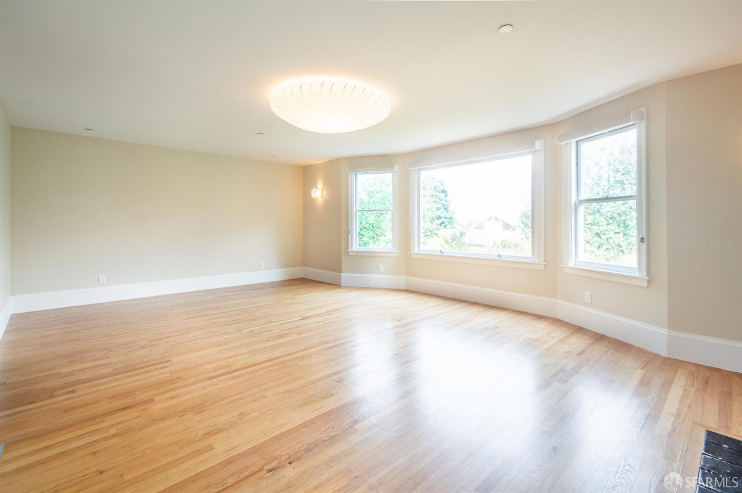 2740 Union Street San Francisco, CA 94123 - Photo 23 of 87 an empty room with wooden floor and windows