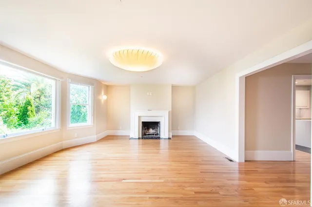 a view of a livingroom with furniture and a fireplace