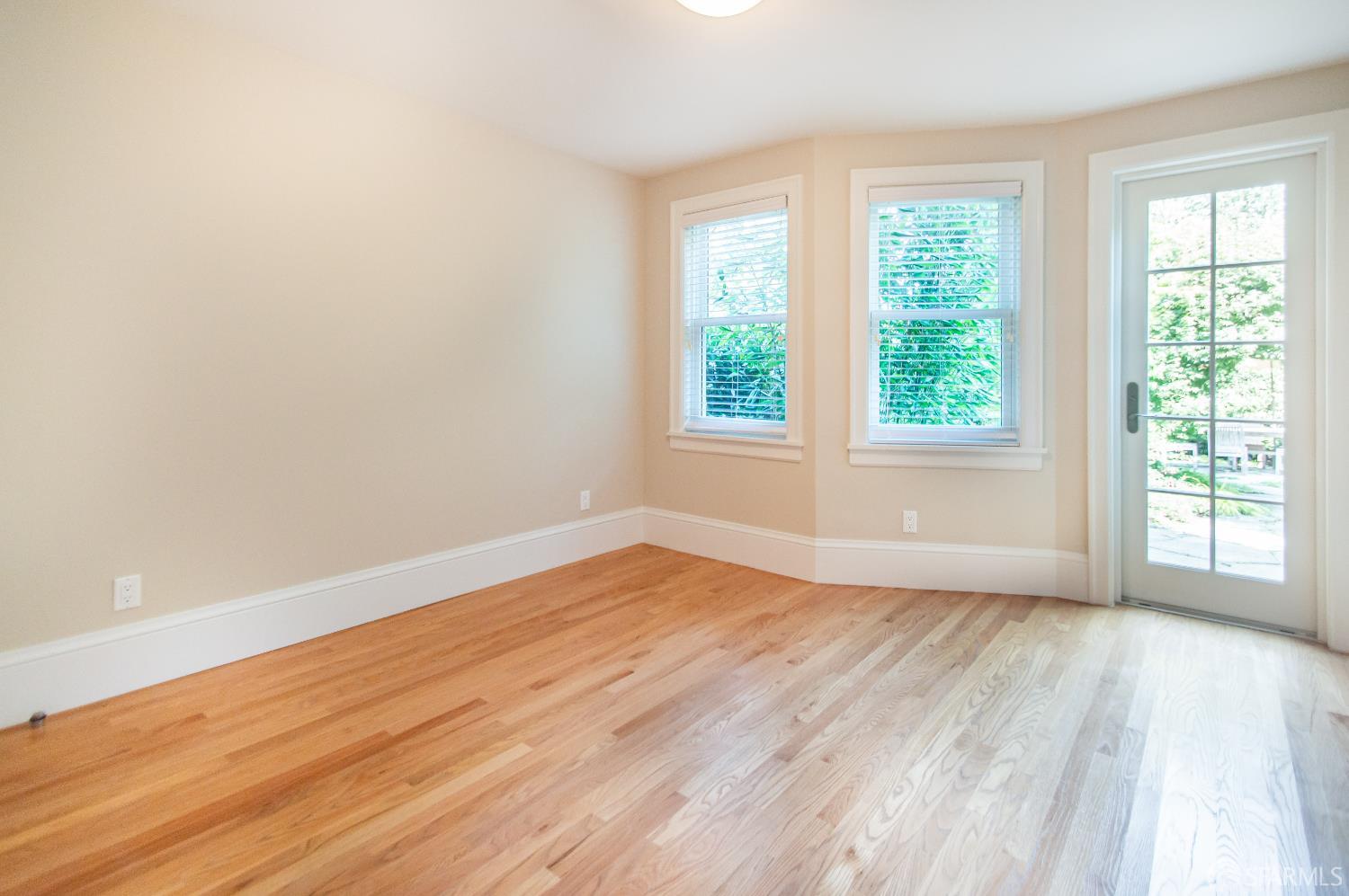 2740 Union Street San Francisco, CA 94123 - Photo 28 of 87 an empty room with wooden floor and windows