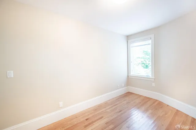 a kitchen with stainless steel appliances granite countertop a refrigerator and a stove