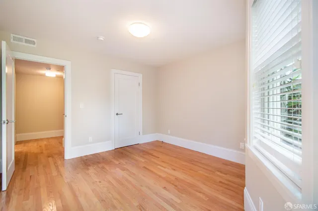 a kitchen with stainless steel appliances a sink a stove a microwave and cabinets