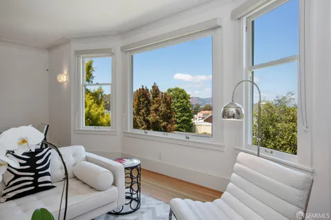 a bedroom with a bed and a cabinets