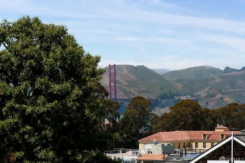 a bedroom with two beds and a window
