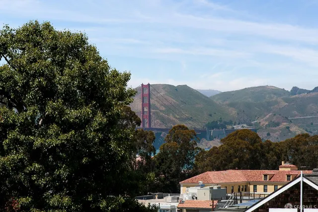 a bedroom with two beds and a window