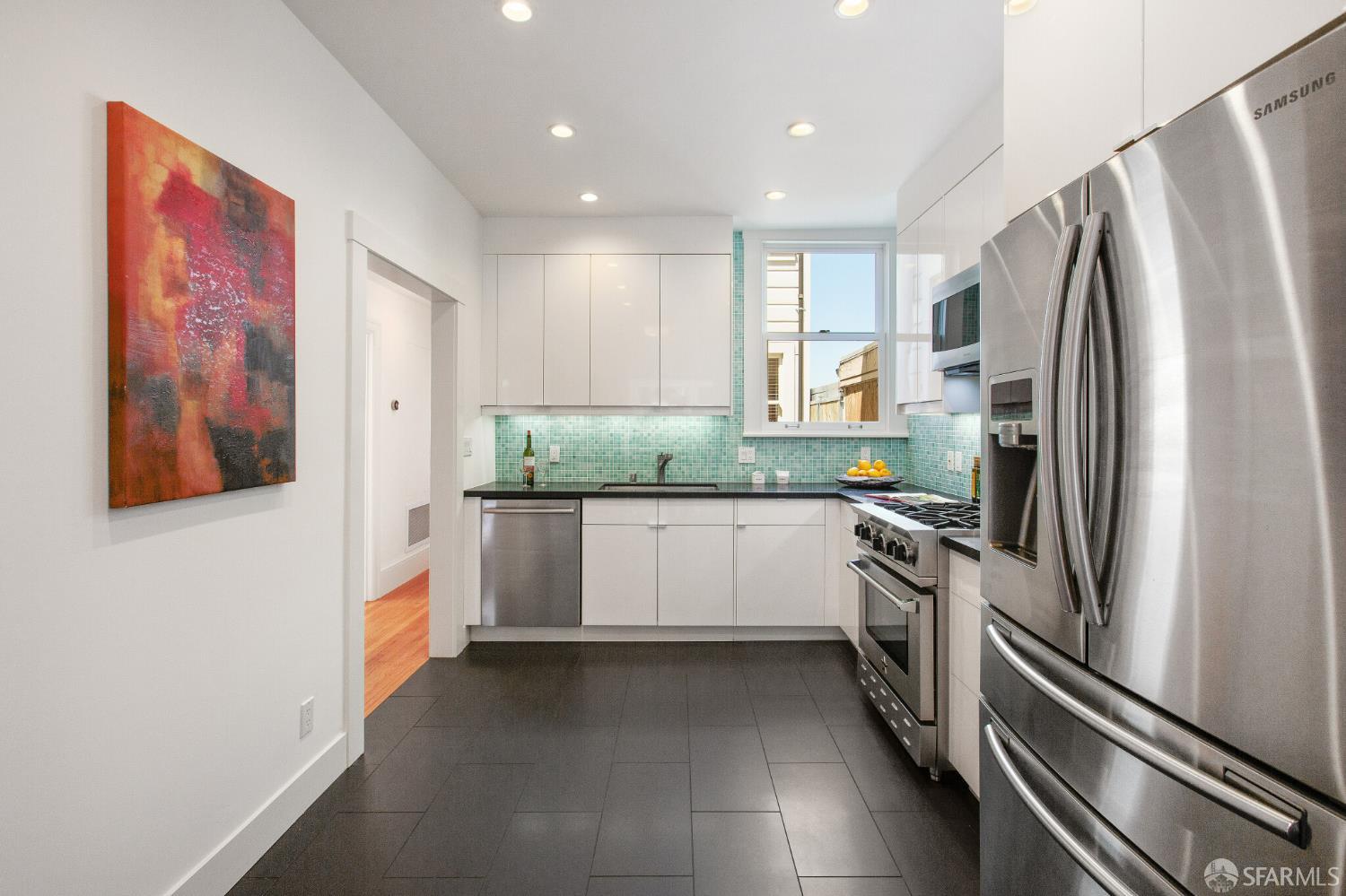 2740 Union Street San Francisco, CA 94123 - Photo 47 of 87 a kitchen with stainless steel appliances granite countertop a refrigerator and a stove