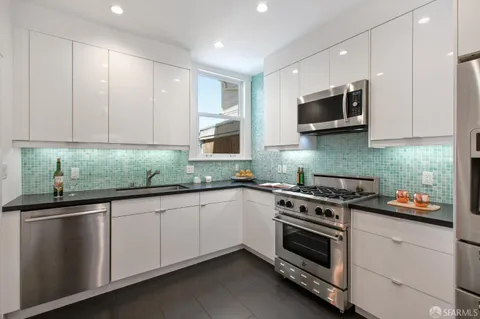 a white bath tub sitting next to a white toilet