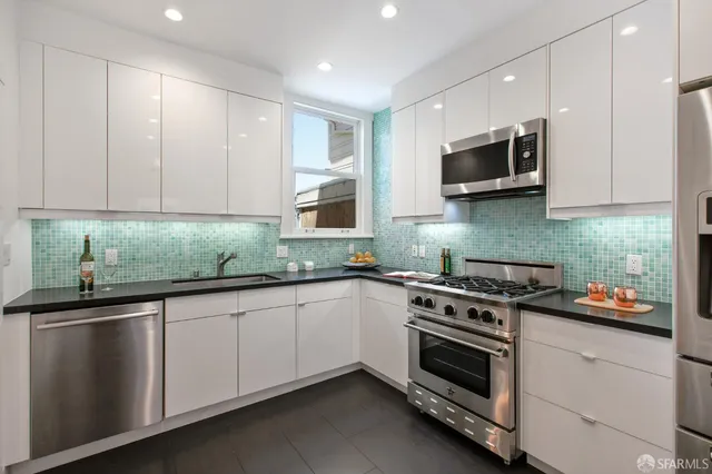 a white bath tub sitting next to a white toilet