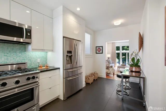 a view of backyard with seating space and trees