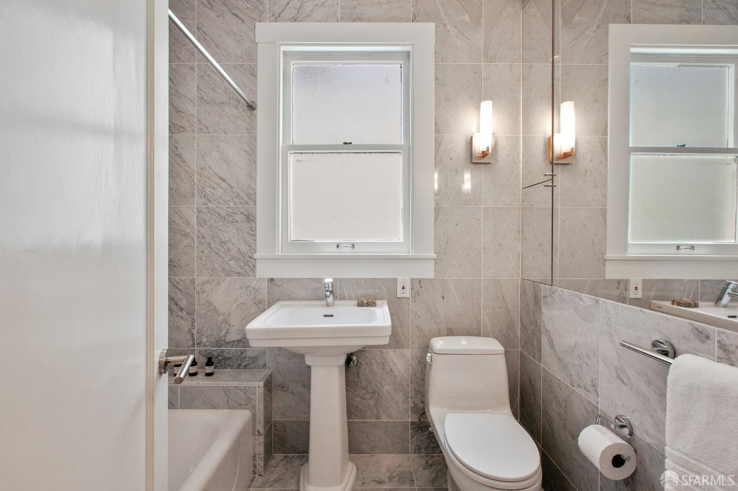 2740 Union Street San Francisco, CA 94123 - Photo 62 of 87 a bathroom with a sink a toilet and mirror