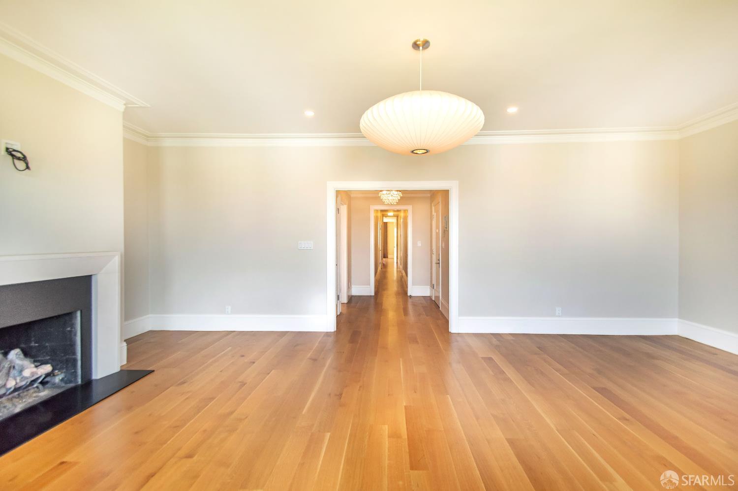2740 Union Street San Francisco, CA 94123 - Photo 65 of 87 a view of an empty room with wooden floor and a fireplace