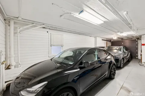 a view of storage and utility room with wooden floor