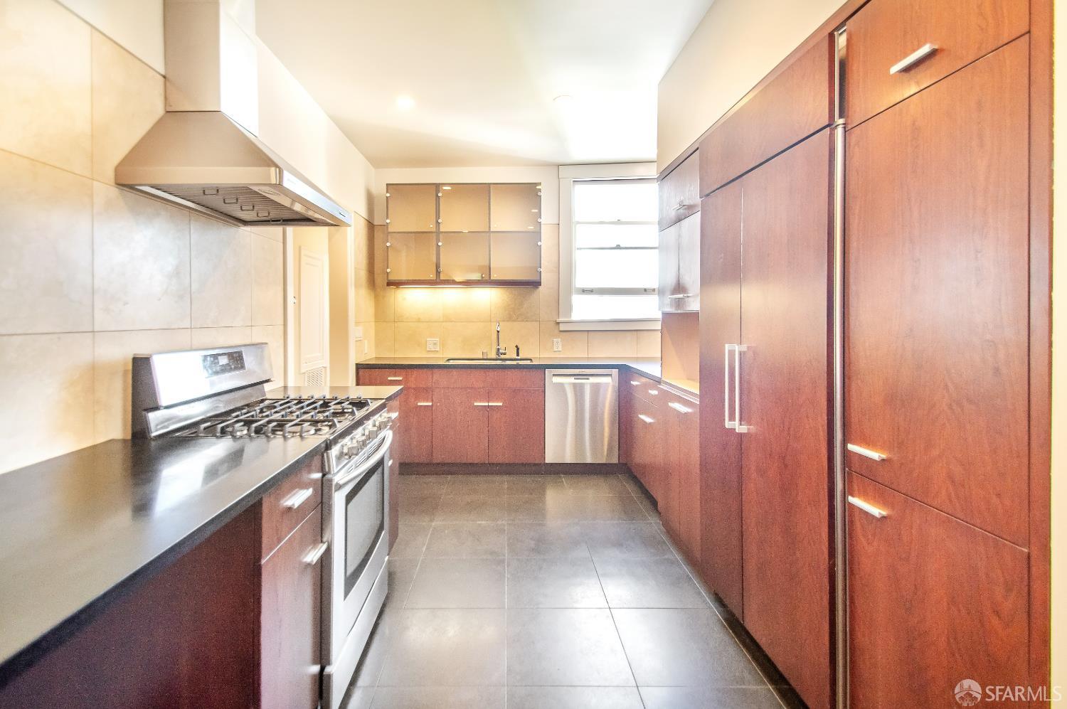 2740 Union Street San Francisco, CA 94123 - Photo 72 of 87 a kitchen with stainless steel appliances granite countertop a stove a sink and a refrigerator