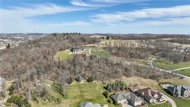 a backyard of a house with large trees