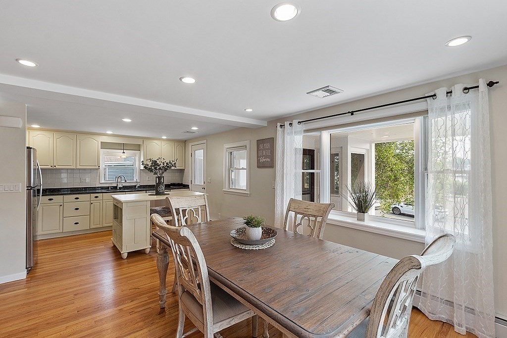 16 Choate Avenue Danvers, MA 01923 - Photo 5 of 32 a open dining room with stainless steel appliances furniture large window and wooden floor