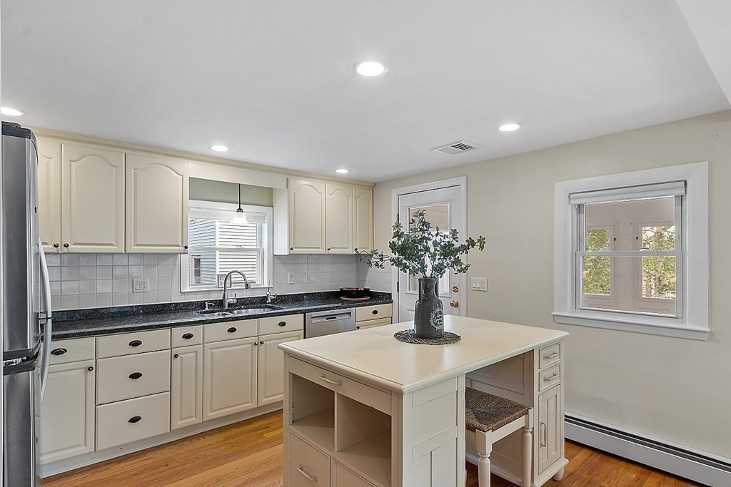 16 Choate Avenue Danvers, MA 01923 - Photo 7 of 32 a kitchen with cabinets stainless steel appliances a sink and a window