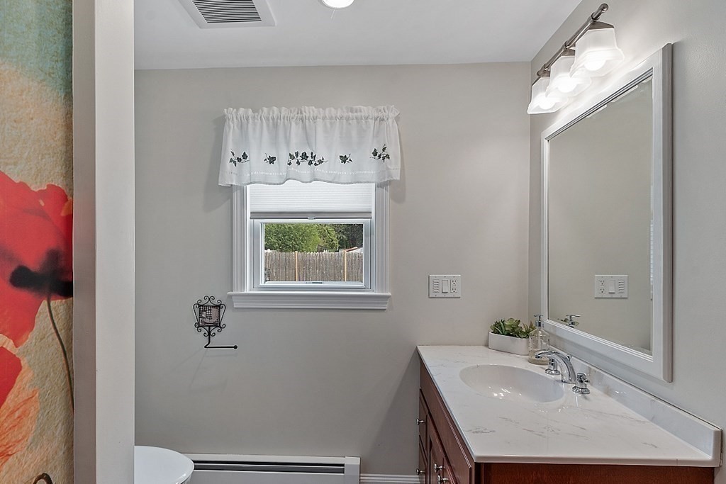 16 Choate Avenue Danvers, MA 01923 - Photo 8 of 32 a bathroom with a sink and a mirror