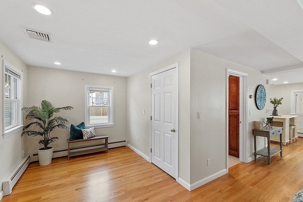 16 Choate Avenue Danvers, MA 01923 - Photo 9 of 32 a view of a livingroom with wooden floor and a potted plant