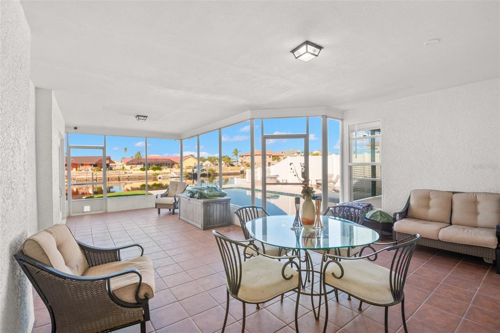 5451 Windward Way New Port Richey, FL 34652 - Photo 11 of 36 a dining room with furniture and a large window