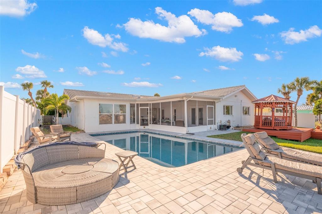 5451 Windward Way New Port Richey, FL 34652 - Photo 14 of 36 a view of a house with swimming pool and sitting area