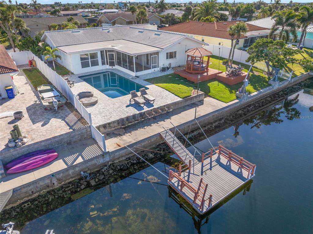 5451 Windward Way New Port Richey, FL 34652 - Photo 15 of 36 an aerial view of a house with a swimming pool
