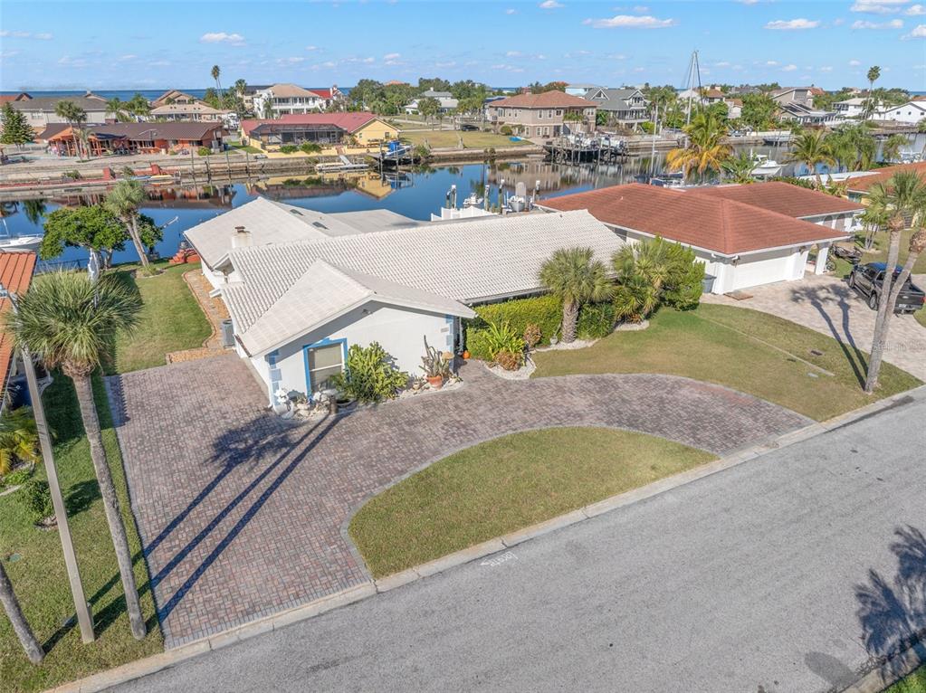 5451 Windward Way New Port Richey, FL 34652 - Photo 16 of 36 an aerial view of residential houses with outdoor space and parking