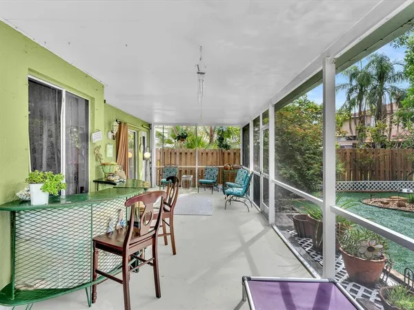 a front view of a house with a yard table and chairs
