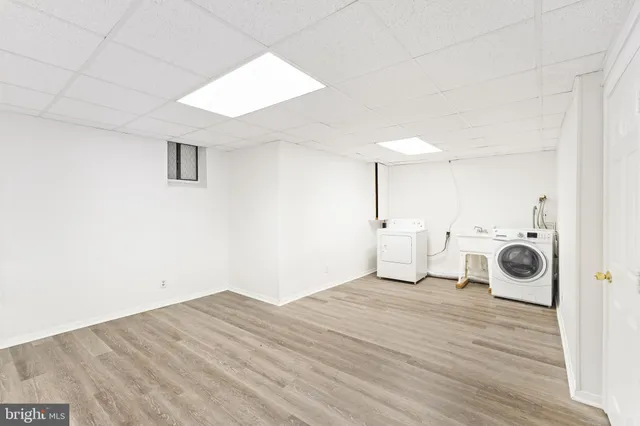a view of a kitchen with a stove and wooden floor