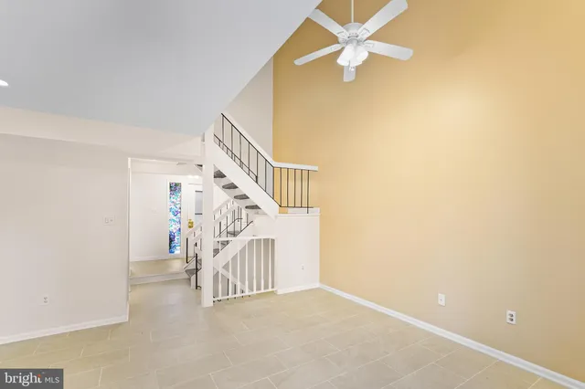 a view of entryway and hall with a fan