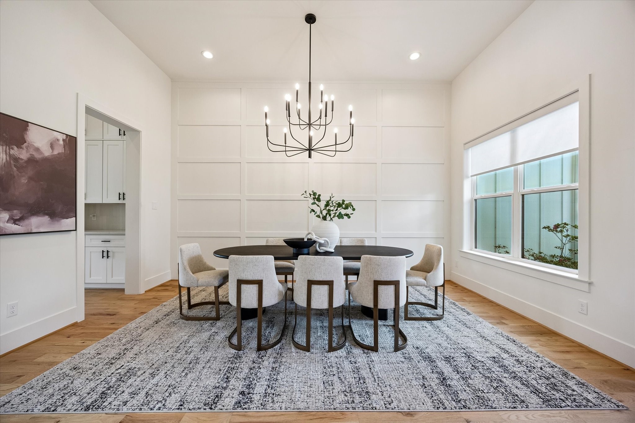 1729 Chippendale Road Houston, TX 77018 - Photo 2 of 45 The board-and-batten detailing adds a sophisticated touch and visual dimension to this grand dining space.