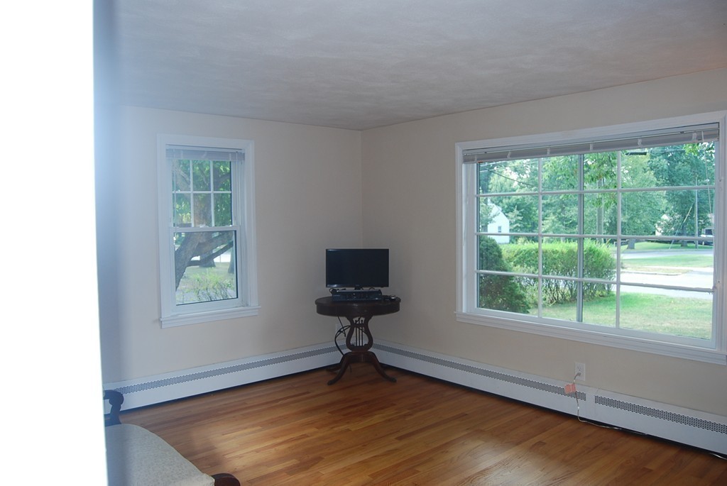687 Plumtree Road Springfield, MA 01118 - Photo 11 of 27 a view of an empty room with wooden floor and a window