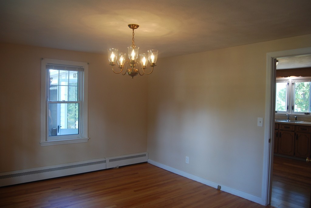 687 Plumtree Road Springfield, MA 01118 - Photo 14 of 27 a view of empty room with wooden floor and fan