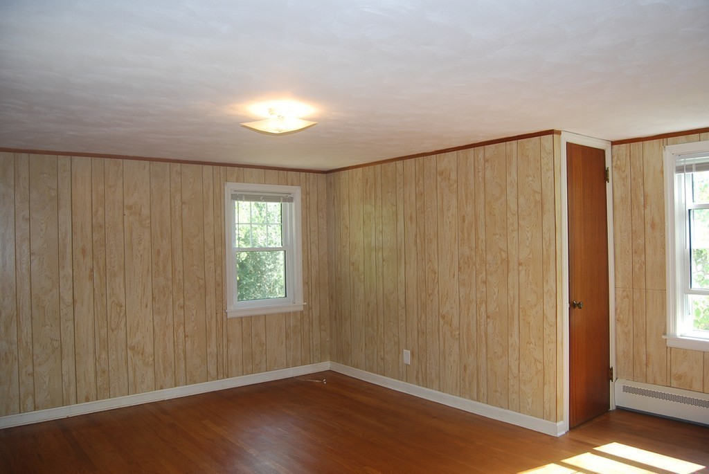 687 Plumtree Road Springfield, MA 01118 - Photo 16 of 27 a view of an empty room with wooden floor and a window