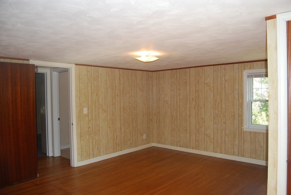 687 Plumtree Road Springfield, MA 01118 - Photo 17 of 27 a view of an empty room with wooden floor and a window
