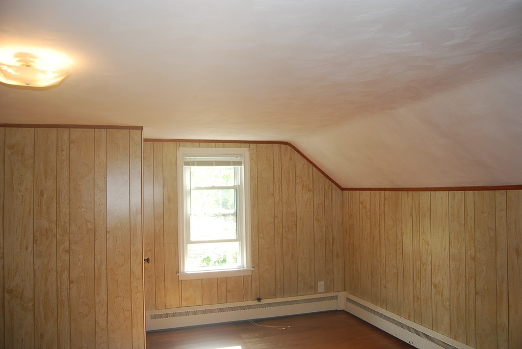 687 Plumtree Road Springfield, MA 01118 - Photo 18 of 27 a view of a small space with wooden floor and a window