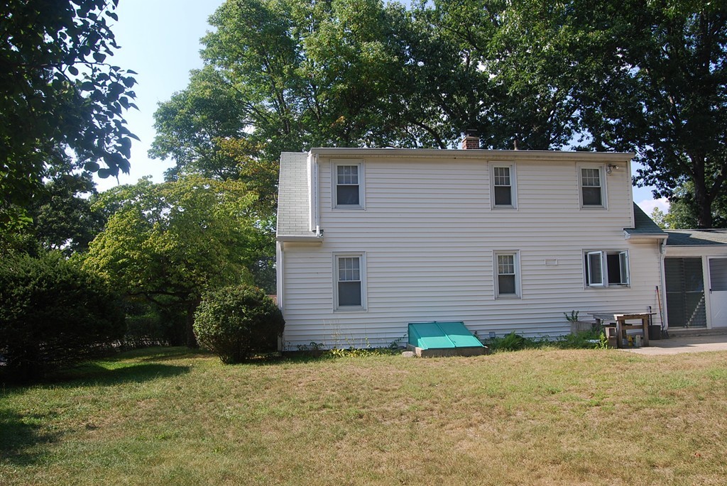 687 Plumtree Road Springfield, MA 01118 - Photo 5 of 27 a front view of house with yard and trees