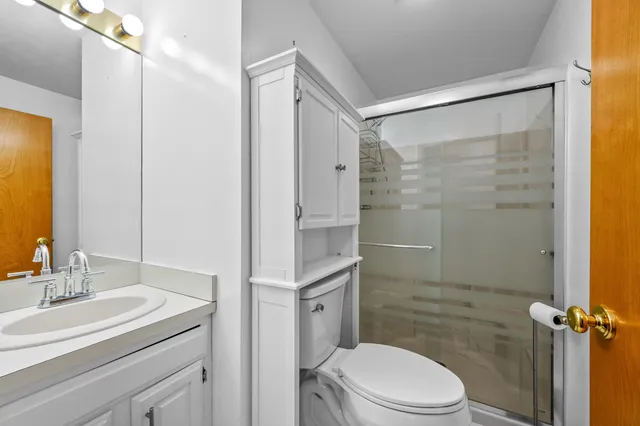 a bathroom with a double vanity sink mirror and