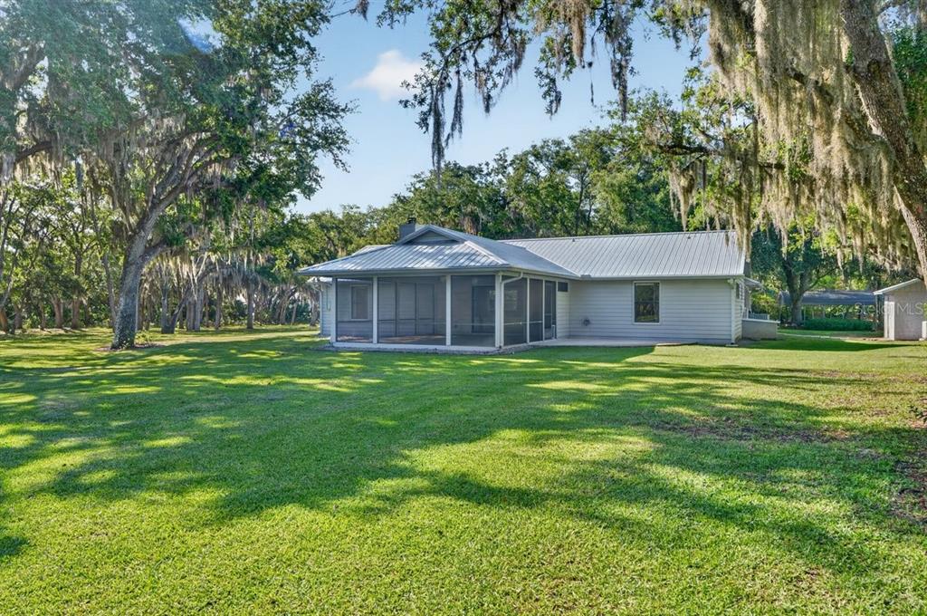 171 William Street Edgewater, FL 32141 - Photo 27 of 40 a front view of a house with a yard
